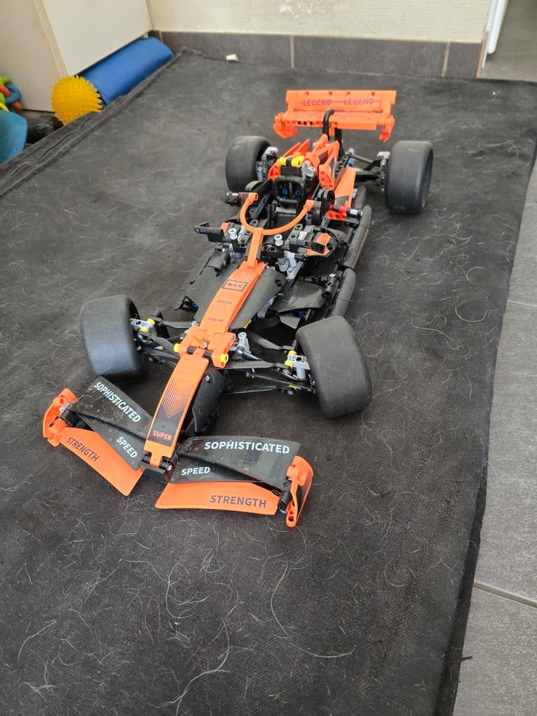 Race auto oranje, Hobby en Vrije tijd, Modelbouw | Auto's en Voertuigen, Ophalen, Zo goed als nieuw, Auto, Overige merken