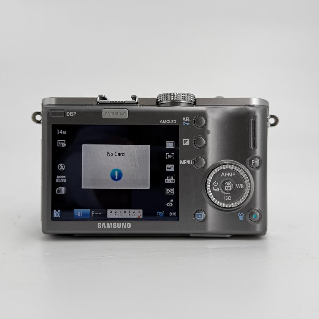 Samsung NX100 Systeemcamera + 20–50mm f/3.5–5.6 ED Lens, Audio, Tv en Foto, Fotocamera's Digitaal, Samsung, Zo goed als nieuw
