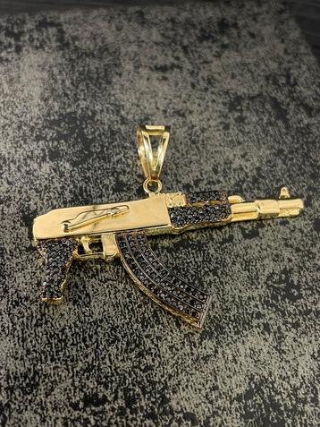 14 karaats gouden AK 47 geweer kettinghanger met onyx steen