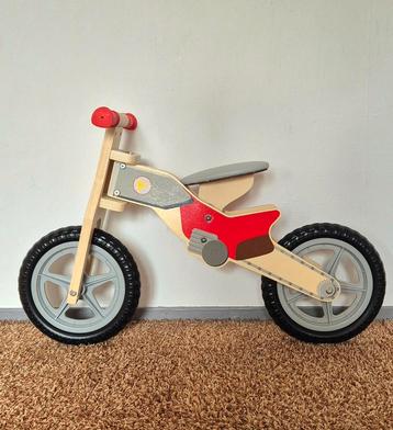 Houten loopfiets beschikbaar voor biedingen