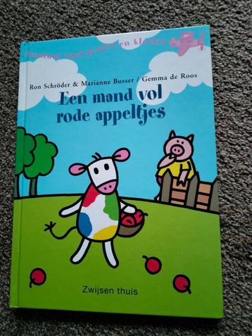leesboek mand vol rode appeltjes beschikbaar voor biedingen
