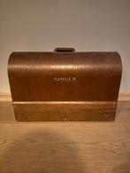 Antieke Singer naaimachine, Ophalen