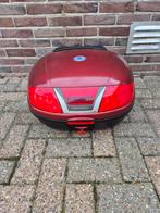 Topkoffer motor., Ophalen