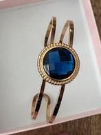 Melano goudekleurige armband met blauwe steen Nieuw, Overige materialen, Blauw, Nieuw, Ophalen of Verzenden