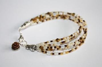 Laagjes armband in wit, amber en copper beschikbaar voor biedingen