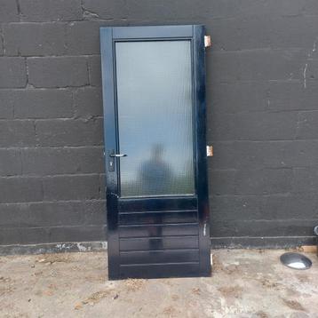 Hardhouten buitendeur met glas beschikbaar voor biedingen