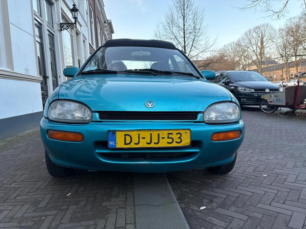 Mazda 121 1.3 I 16V Cabriotop U9 1991 Blauw, Auto's, Mazda, Voorwielaandrijving, Stof, Zwart, 4 cilinders