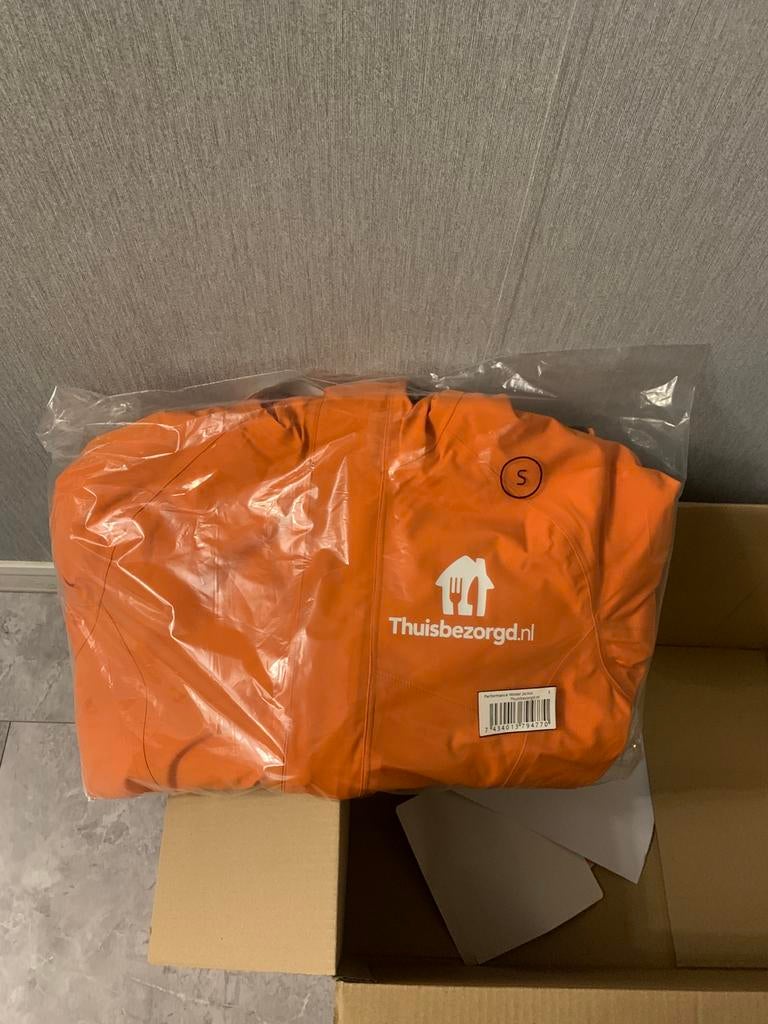 Nieuw! Thuisbezorgd winterjas, Ophalen of Verzenden, Nieuw, Oranje