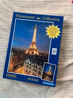 Puzzel Eiffeltoren Parijs Fluorescent 1000 stukjes Clementon, Ophalen of Verzenden, 500 t/m 1500 stukjes, Zo goed als nieuw, Legpuzzel