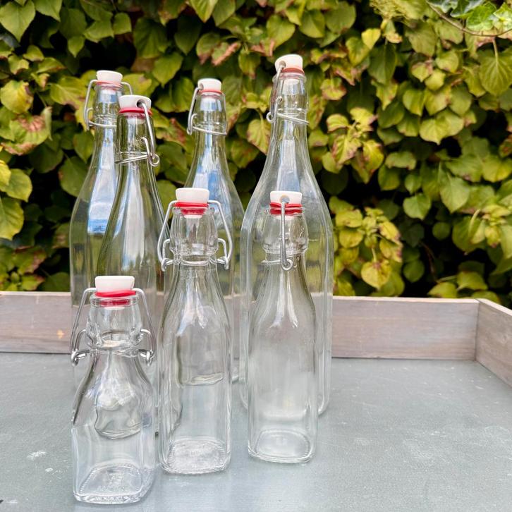 Glazen flessen met beugelsluiting, Huis en Inrichting, Woonaccessoires | Vazen, Zo goed als nieuw, Overige kleuren, Minder dan 50 cm
