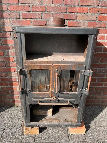 Vrijstaande houtkachel opknapper beschikbaar voor biedingen