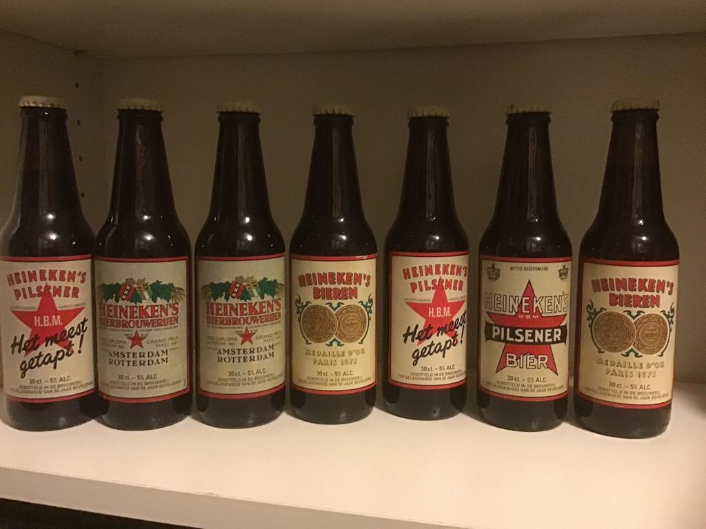 7 flesjes Heineken pils 50 jaar bevrijding., Verzamelen, Ophalen of Verzenden, Zo goed als nieuw, Heineken