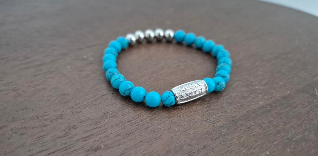 Blauwe Rebel en Rose armband dames vrouwen and mannen & S, Ophalen of Verzenden, Zo goed als nieuw, Blauw, Elastiek