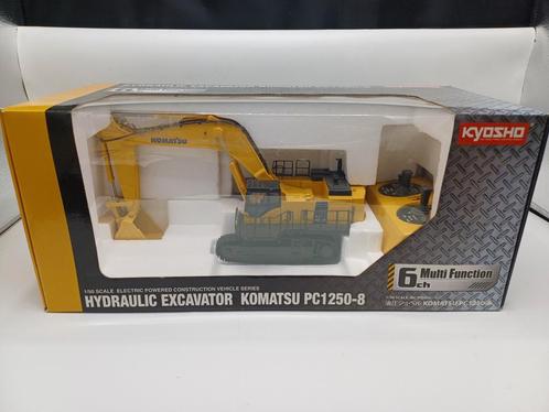 Kyosho Komatsu PC1250 radio grafisch, Hobby en Vrije tijd, Modelauto's | 1:50, Zo goed als nieuw, Auto, Ophalen of Verzenden