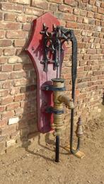 oude gietijzeren waterpomp, Ophalen