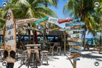 Tuinposter-Beachbar Willemstad Curaçao 150x100 cm (bxh), Tuin en Terras, Tuinwanddecoratie, Verzenden, Nieuw, Good Smiling, Info@goodsmiling.com