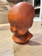 Beeld babyhoofd, Ophalen