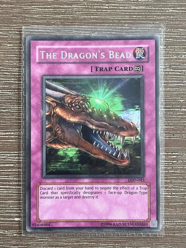 Yu-Gi-Oh! The Dragon's Bead - LOD-043, Hobby en Vrije tijd, Verzamelkaartspellen | Overige, Gebruikt, Losse kaart, Ophalen of Verzenden