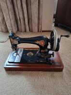 Antieke naaimachine van Singer, Ophalen