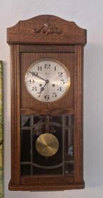 Mooie Athos hangklok met slingermechanisme, Ophalen