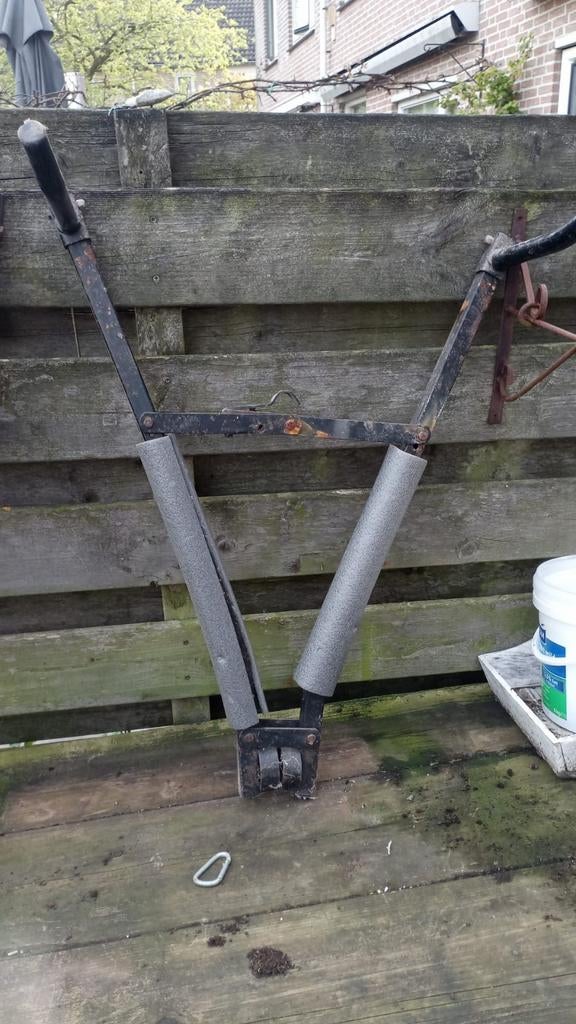 Schaar fietsendrager, Ophalen