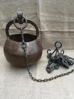 Putemmer met hengsel, Ophalen