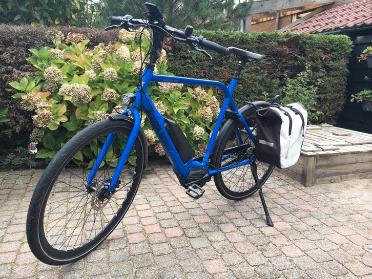 Cortina E Mozzo blauwe herenfiets uit 2019 met nieuwe motor, Fietsen en Brommers, Elektrische fietsen, Zo goed als nieuw, Cortina