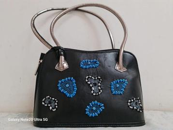 Zwarte handtas met blauw design – stijlvol en uniek beschikbaar voor biedingen
