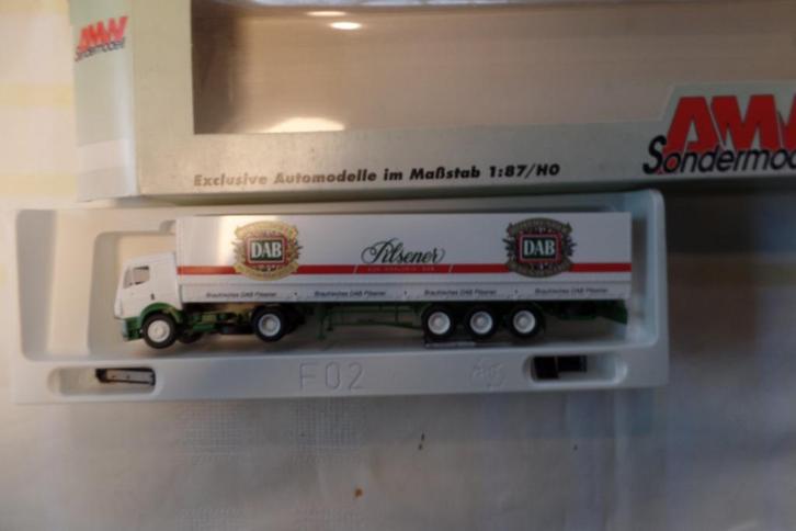 Mercedes trekker / oplegger DAB Pilsener (AWM), Hobby en Vrije tijd, Modelauto's | 1:87, Nieuw, Bus of Vrachtwagen, Ophalen