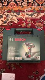 Bosch PSR 12-2,  nog nieuw in koffer, niet gebruikt,., Doe-het-zelf en Verbouw, Gereedschap | Boormachines, Ophalen of Verzenden