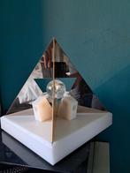 Xenomide piramide, Ophalen