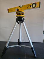 Waterpas laser op statief., Ophalen