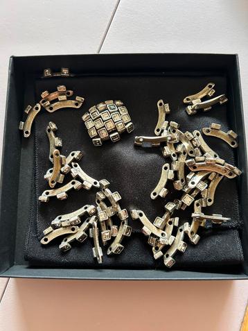 Schakelarmband Zilverkleur & Broche beschikbaar voor biedingen