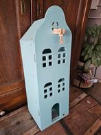 Speelgoed grachtenpand hema, Ophalen