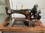 Antieke naaimachine, Ophalen