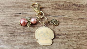 Sleutelhanger Maltezer RVS gold met beschermengeltje beschikbaar voor biedingen