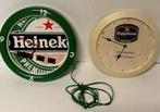 Twee bier reclame klokken Heineken en Oranjeboom