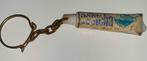 Vintage sleutelhanger tandpasta tube Castella, Verzenden, Gebruikt