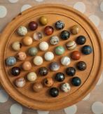 Knikkerspel met (half)edelstenen., Ophalen