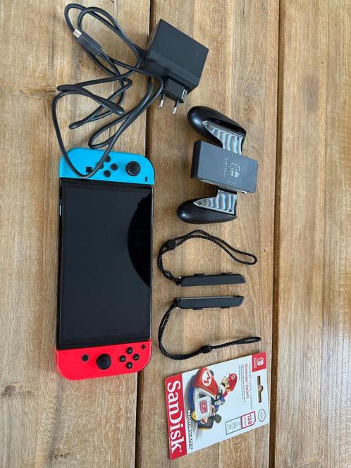 Nintendo Switch OLED zwart+128GB+Mario Wonder+Verzekering, Spelcomputers en Games, Spelcomputers | Nintendo Switch, Zo goed als nieuw