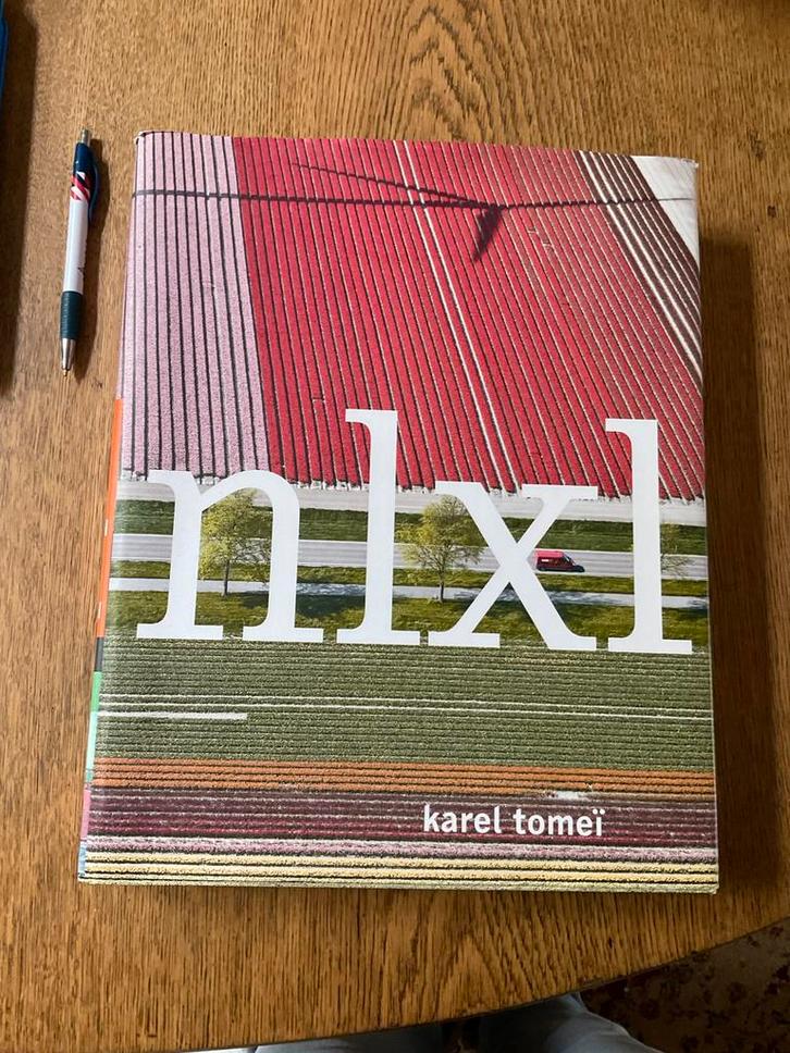 K. Tomei - NLXL, Boeken, Overige Boeken, Zo goed als nieuw, Ophalen of Verzenden