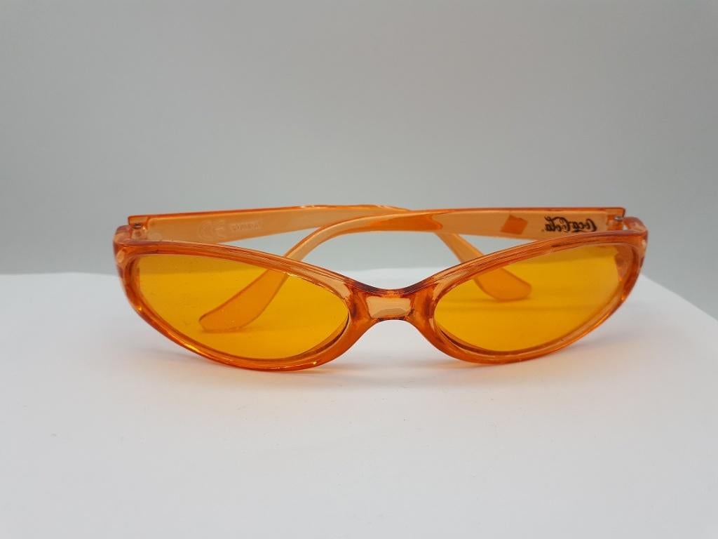 Coca-Cola Zonnebril Oranje plastic, Verzamelen, Merken en Reclamevoorwerpen, Zo goed als nieuw, Gebruiksvoorwerp, Ophalen of Verzenden