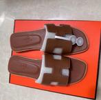 Hermès Oran slippers maat 38 – Bruin – Nieuw in doos, Slippers, Bruin, Nieuw, Ophalen of Verzenden