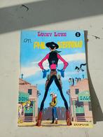 Lucky Luke en Phil IJzerdraad, Boeken, Stripboeken, Gelezen, Eén stripboek, Ophalen of Verzenden, Morris