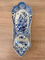 Porceleyne fles wand kaarshouder, Ophalen