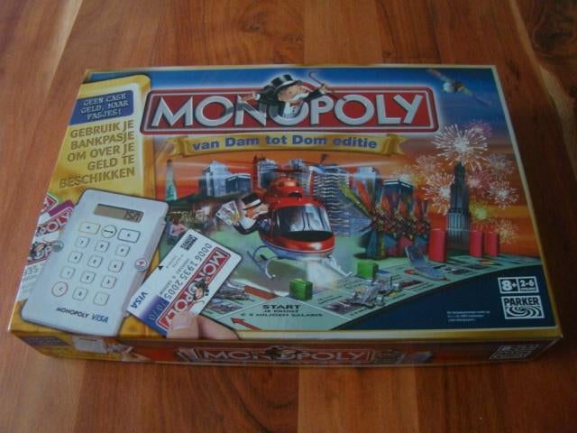Monopoly Van Dam tot Dom editie met pinautomaat, Hobby en Vrije tijd, Gezelschapsspellen | Bordspellen, Ophalen of Verzenden, Zo goed als nieuw