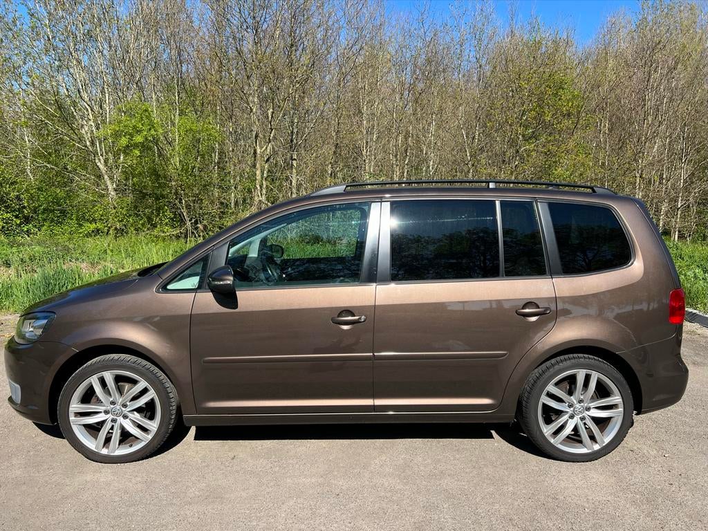 Volkswagen Touran 1.2 TSI 77KW BMT 7P 2011 Bruin km 259.969, Voorwielaandrijving, 4 cilinders, Bruin, 7 stoelen