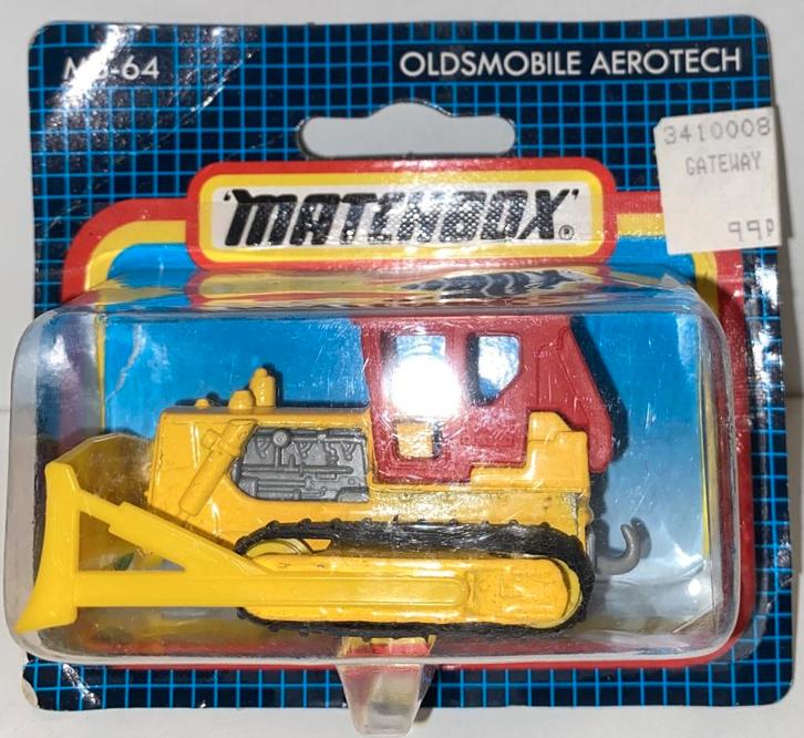 Matchbox 64F-16 Caterpillar D-9 bulldozer in error verp., Hobby en Vrije tijd, Modelauto's | Overige schalen, Zo goed als nieuw