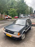 Peugeot 205 1.6 GTI 1985 Zwart, Auto's, Peugeot, Voorwielaandrijving, 850 kg, Zwart, Origineel Nederlands