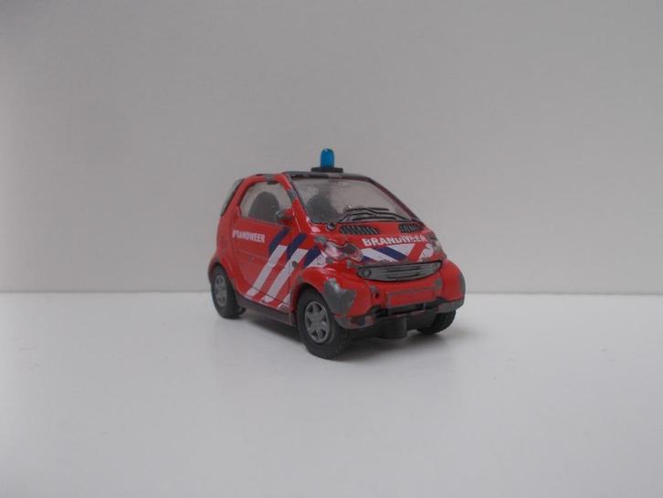 5833 Smart Fortwo Siku 1067, Hobby en Vrije tijd, Modelauto's | Overige schalen, Gebruikt, Auto, Ophalen of Verzenden